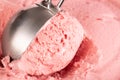 Extreme close up of strawberry ice cream being scooped