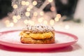 Beautiful tasty cream puff with hazelnuts