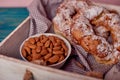 A beautiful and tasty Kringle covered with almonds with cup of almonds, breakfast concept Royalty Free Stock Photo