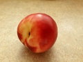 Beautiful tasty nectarine on the table