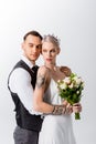 Beautiful tattooed bride and handsome bridegroom