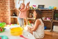 Beautiful teacher and blond student toddler girl playing with dinosaurs at kindergarten Royalty Free Stock Photo