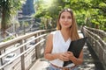 Beautiful executive business woman walking in modern sustainable metropoli Royalty Free Stock Photo