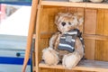 Beautiful teddy bear with winter scarf displayed for child charity