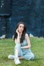 A beautiful teen brunette girl with a serious look and looking away Royalty Free Stock Photo