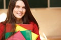 Beautiful teen girl in classroom happy smiling