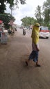 A beautiful teen girl crossing the road