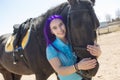 Beautiful teen girl on the farm with her horse. Royalty Free Stock Photo