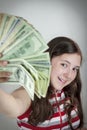 Beautiful teen girl holding US dollars Royalty Free Stock Photo