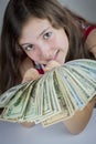 Beautiful teen girl holding US dollars Royalty Free Stock Photo