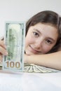 Beautiful teen girl holding US dollars Royalty Free Stock Photo