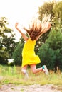 Beautiful teen girl Is jumping outside at summer sunset Royalty Free Stock Photo