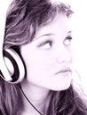 Beautiful Teen Girl Listening To Headphones In Grape Tones