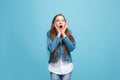 Beautiful teen girl looking suprised isolated on blue Royalty Free Stock Photo