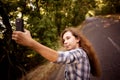 Beautiful teen girl making selfie on mobile phone Royalty Free Stock Photo