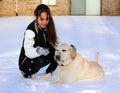 Beautiful teen girl playing with Labrador retriever