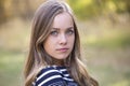 Beautiful teen girl portrait outdoors. Beautiful young face looking at the camera Royalty Free Stock Photo