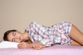 Beautiful teen girl sleeping with orthopedic pillow on bed Royalty Free Stock Photo