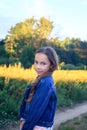 Beautiful Teen Girl is smiling and  enjoying nature in the park at Summer sunset Royalty Free Stock Photo