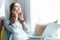 beautiful teen girl using laptop and listening music with earphones Royalty Free Stock Photo