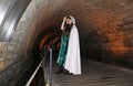 A teenage girl in the Templars tunnel in Akko, Israel