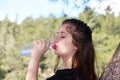 A beautiful teenage girl drinking water Royalty Free Stock Photo