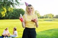 Beautiful teenage girl in a festiv hat on her birthday with a cake and candles.