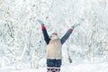 Beautiful teenage girl having fun outside in a wood with snow in winter. happy and active life consept Royalty Free Stock Photo