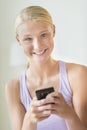 Beautiful Teenage Girl Holding Smart Phone Royalty Free Stock Photo