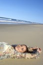 Beautiful Teenage Girl Lying On Sandy Beach Royalty Free Stock Photo