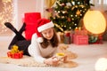 Beautiful teenage girl opening her christmas present Royalty Free Stock Photo