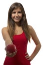 Beautiful teenage girl portrait offering one red apple