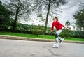 Beautiful teenage girl roller-skating Royalty Free Stock Photo