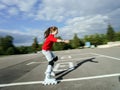 Beautiful teenage girl roller-skating Royalty Free Stock Photo