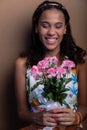 Beautiful teenage girl, sitting, with bouquet of flowers Royalty Free Stock Photo