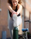Beautiful teenage girl stretching leg muscle Royalty Free Stock Photo