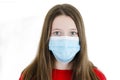 Beautiful teenage girl wearing medical face mask because of air, Teenage girl social distancing from corona virus covid-19. Royalty Free Stock Photo