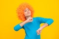 Beautiful teenage girl in wig isolated on yellow. Funny clown wig. Excited teenager, glad amazed and overjoyed emotions. Royalty Free Stock Photo