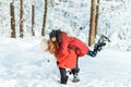 Beautiful teenage girls having fun outside in a wood with snow in winter. Friendship and active life consept Royalty Free Stock Photo