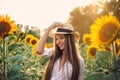 Beautiful Teenage Model girl with long healthy hair posing on the Sunflower Spring Field Royalty Free Stock Photo