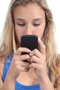 Beautiful teenager girl concentrated in her mobile phone Royalty Free Stock Photo