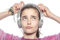 Beautiful teenager girl fumble on her headphones Royalty Free Stock Photo