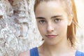 Beautiful teenager girl leaning against a wall Royalty Free Stock Photo