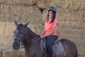 Beautiful teenager with his horse learning to ride Royalty Free Stock Photo