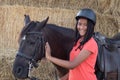 Beautiful teenager with his horse learning to ride Royalty Free Stock Photo