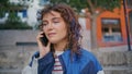 Beautiful teenager talking cellphone at urban district close up. Girl calling Royalty Free Stock Photo