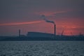 Telephoto view of epic red sunset over Dublin port and Covanta Plant Dublin Waste to Energy seen from west pier, Dun Laoghaire Royalty Free Stock Photo