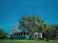 A beautiful temple in the garden with tree in front side