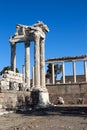 Beautiful temple of Trajan with white marble columns on blue sky background, ancient city Pergamon, Turkey Royalty Free Stock Photo