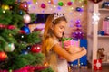 Beautiful ten-year-old girl received a gift from Santa Claus Royalty Free Stock Photo